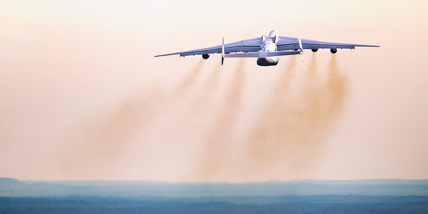 Rear view of the Antonov An-225 in flight showing its twin tail